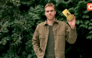 Connor McDavid holding a phone displaying the BetMGM logo
