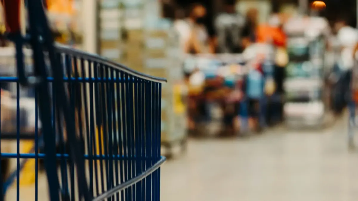 Shopping trolley in a supermarket aisle