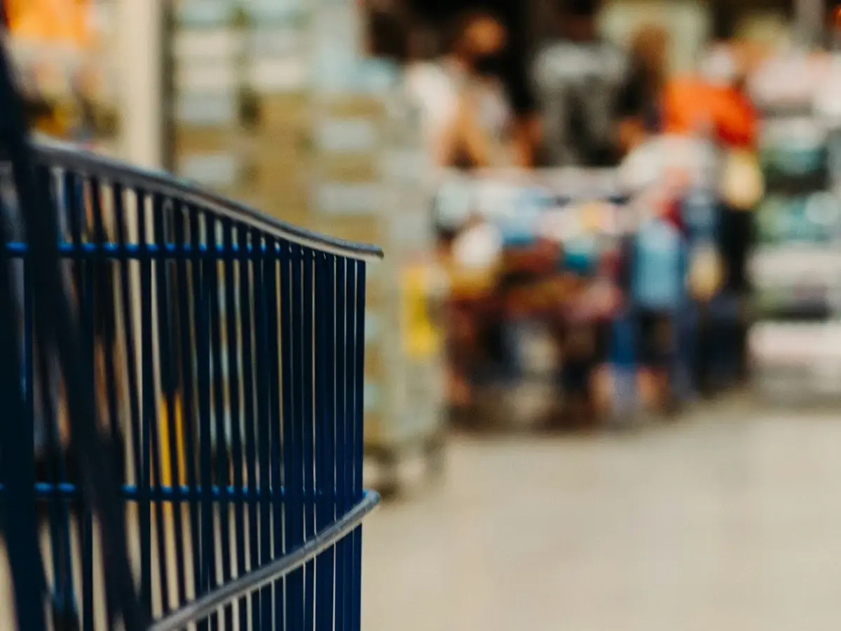 Shopping trolley in a supermarket aisle