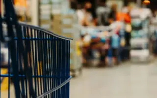 Shopping trolley in a supermarket aisle