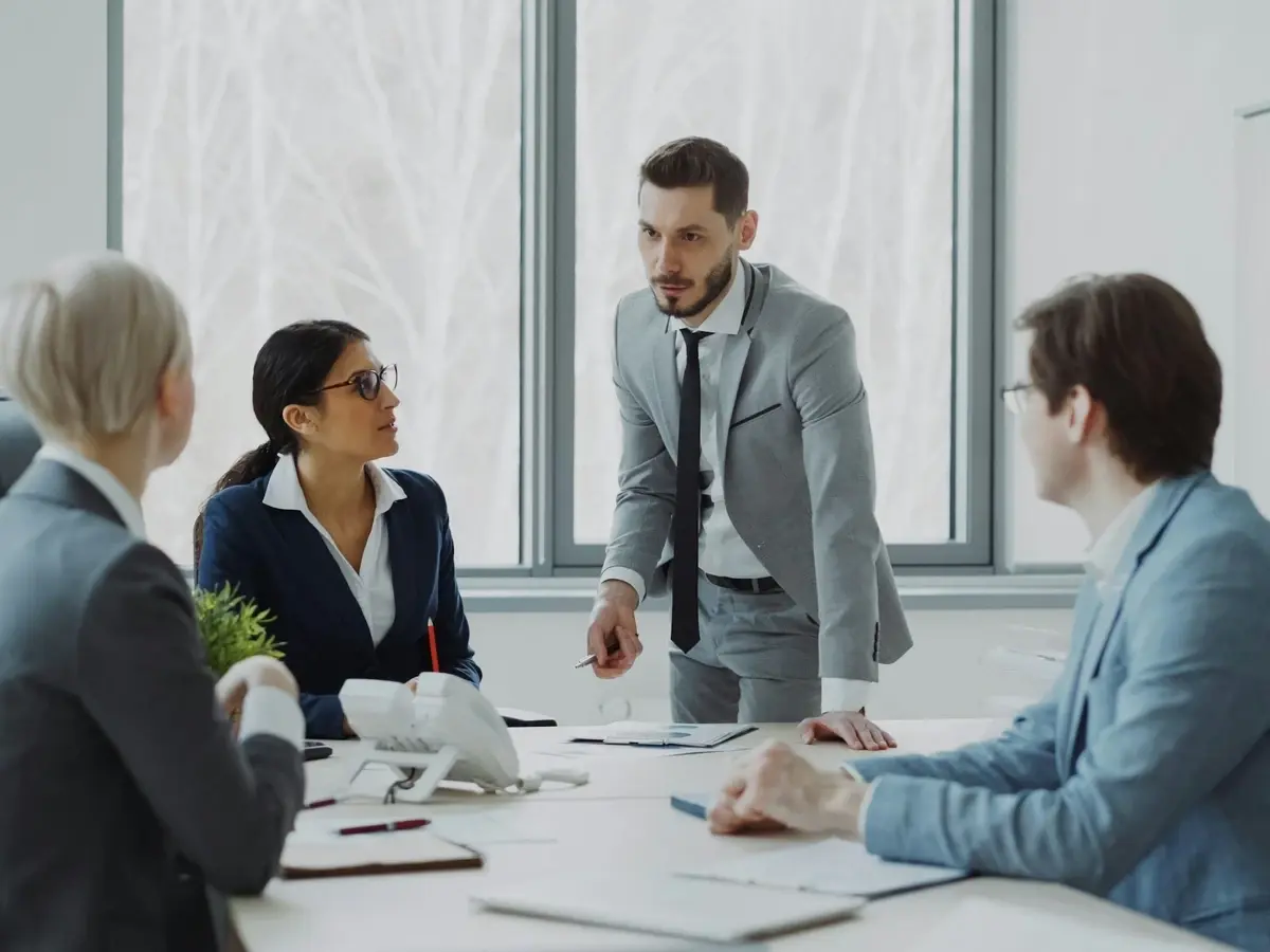 Business professionals in a meeting around a table