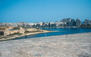 Stone fortification overlooking the harbour and skyline in Valletta, Malta, where Catena Media is headquartered