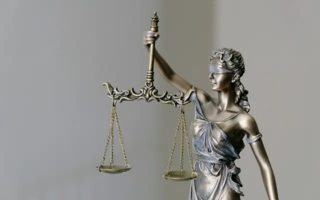 Lady Justice statue holding scales and a sword