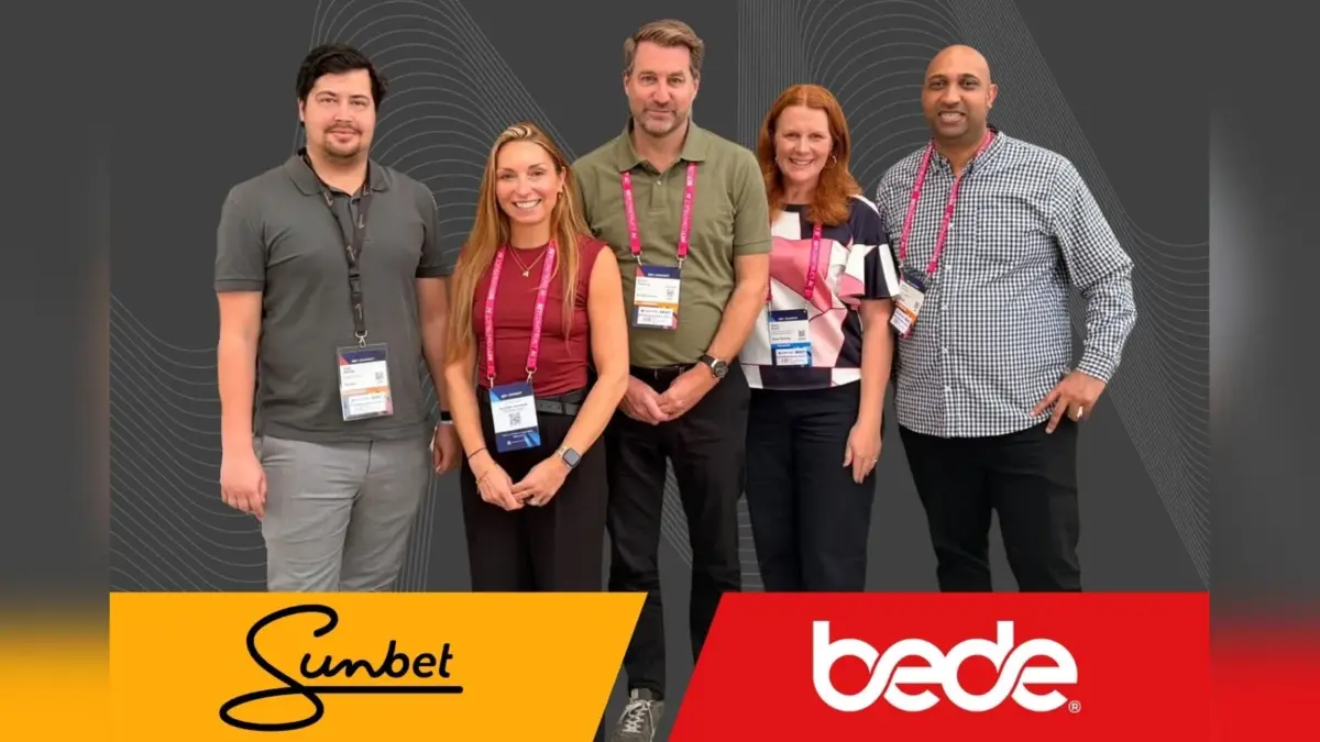 Sunbet and Bede Gaming teams at SBC Summit with both company logos