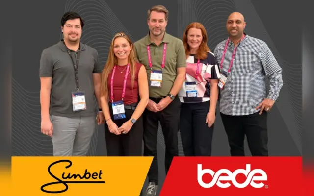 Sunbet and Bede Gaming teams at SBC Summit with both company logos